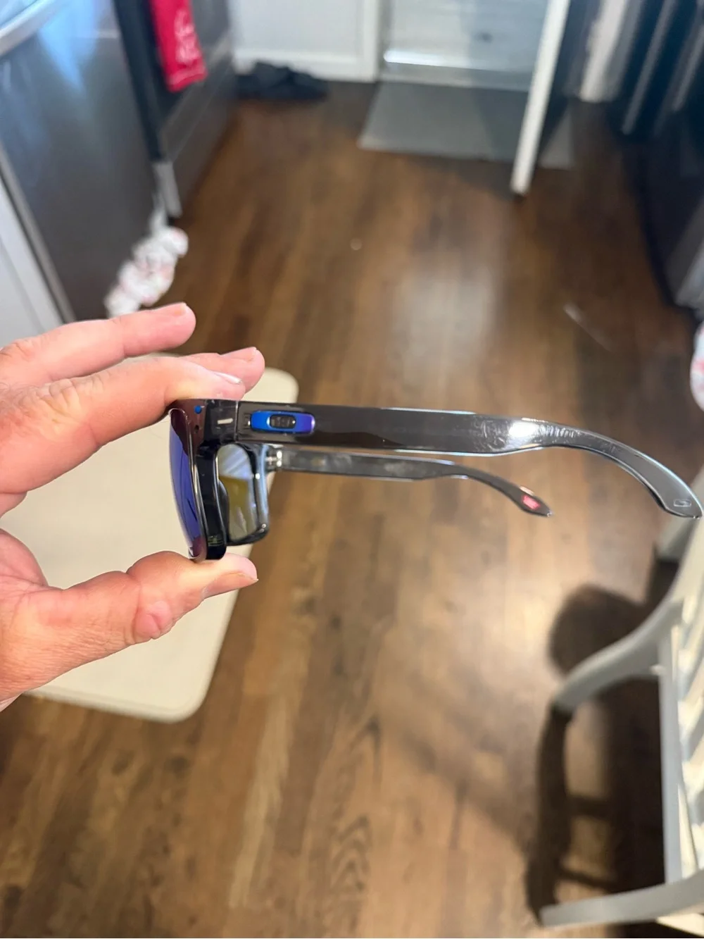 Oakley Black Frame Sunglasses with Blue Mirrored Lenses